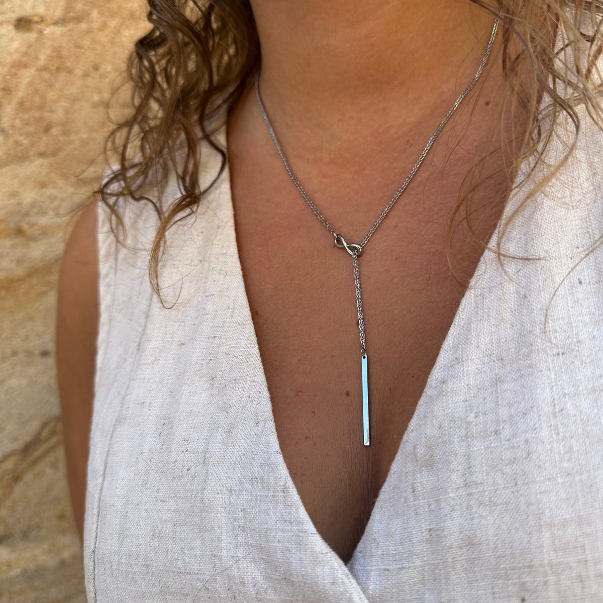 Collier Y coulissant signe infini
