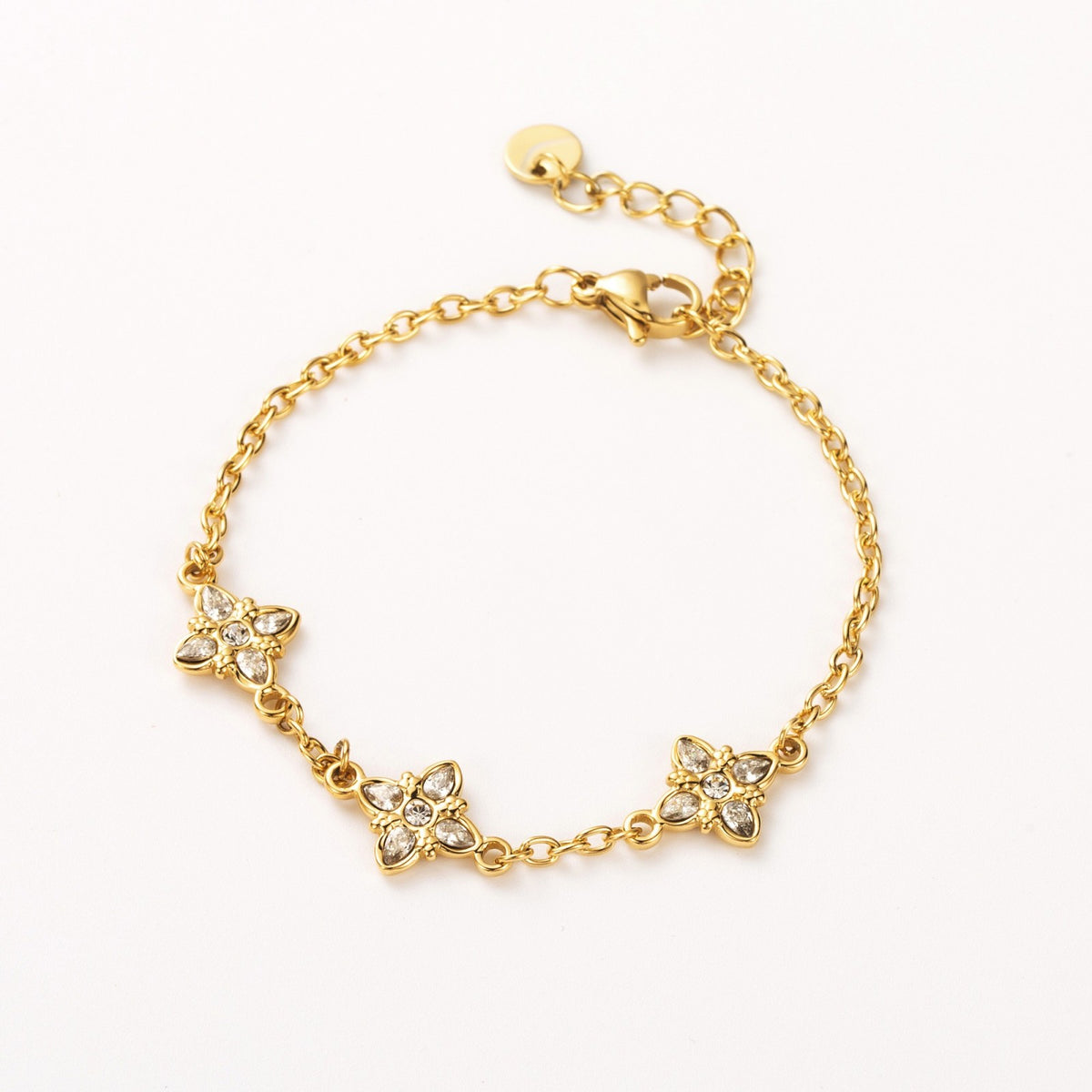 bracelet acier inoxydable doré trèfles empierrés oxydes de zirconium résiste à l'eau hypoallergénique
